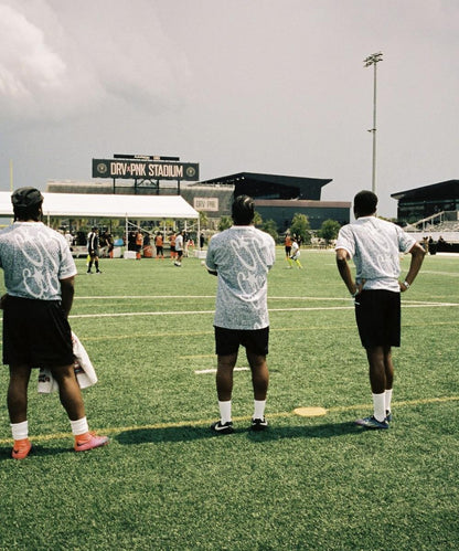 Blue and white all-over printed football uniform