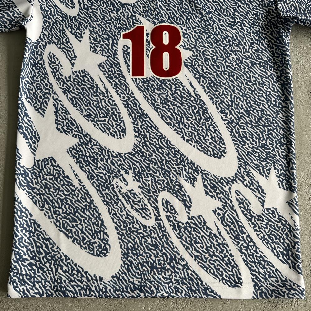 Blue and white all-over printed football uniform